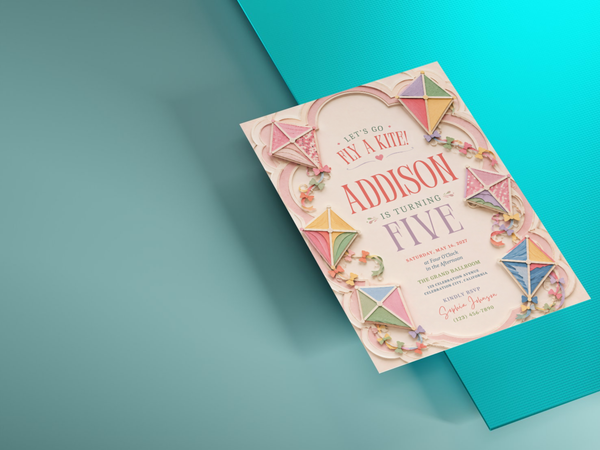 Printable kite birthday invitation featuring pastel colors, decorative kites and a light celebratory background