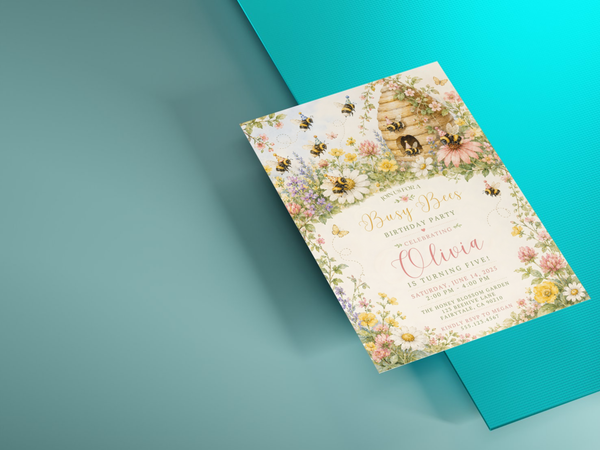 Floral Busy Bees birthday invitation template featuring detailed honey bees, a beehive, wildflowers and pastel botanical accents.