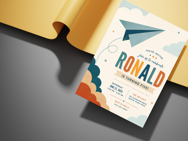 Airplane themed birthday invitation template with paper plane imagery, sky and cloud motifs, teal and blue tones, orange highlights, and playful typography.